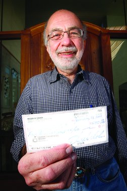 Roger
        Cohen is prominently displaying his tentative $5,000 check.